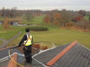Soft Washing of a roof using AlgoClear: for long lasting moss and lichen clearance -  All roof cleaning Services by Roof Repairs Belfast,  Northern Ireland