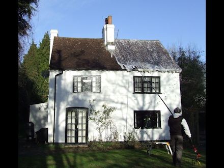 Soft Washing of a roof using AlgoClear: for long lasting moss and lichen clearance -  All roof cleaning Services by Roof Repairs Belfast, Northern Ireland